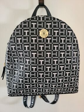 Tommy Hilfiger Black & White Monogram Dome Backpack With Canvas Straps.